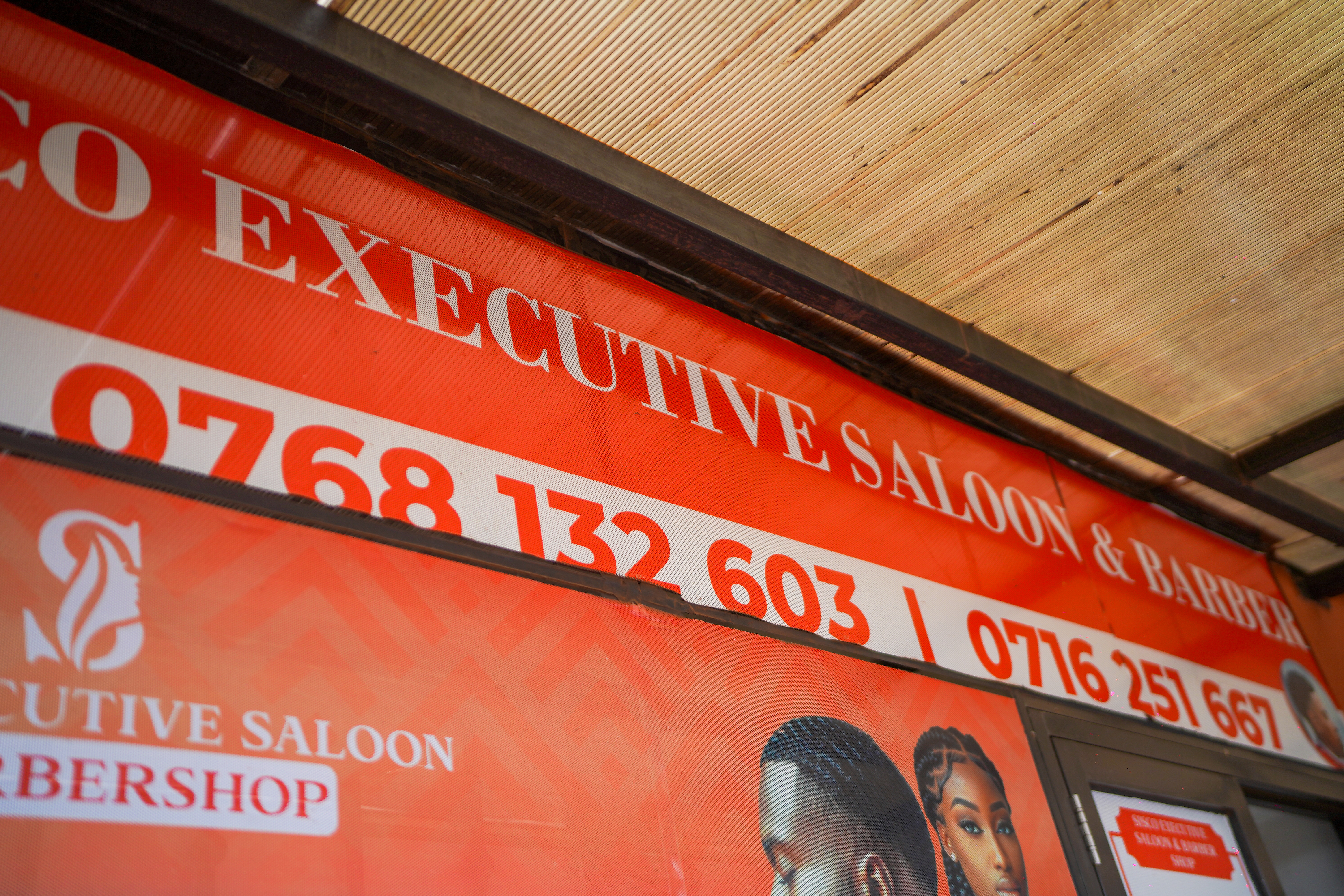 Sisco Executive Saloon & Barber signage banner