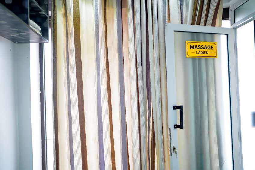 Massage Ladies room — frosted glass door with curtain