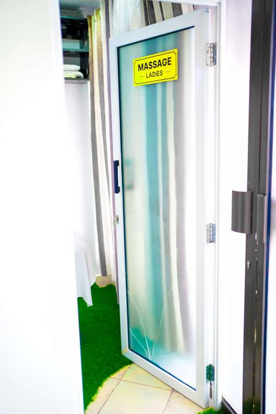 Massage Ladies door — striped privacy curtain corridor